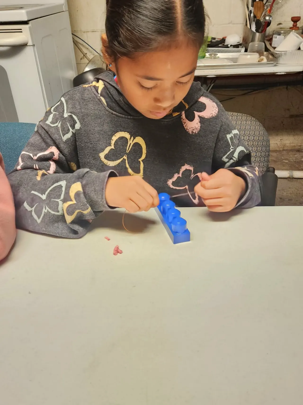 Young participant practicing dental care with learning tools